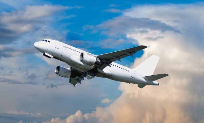 Airplane,Flying,In,The,Sky,-,Travel,Background,With,Flying